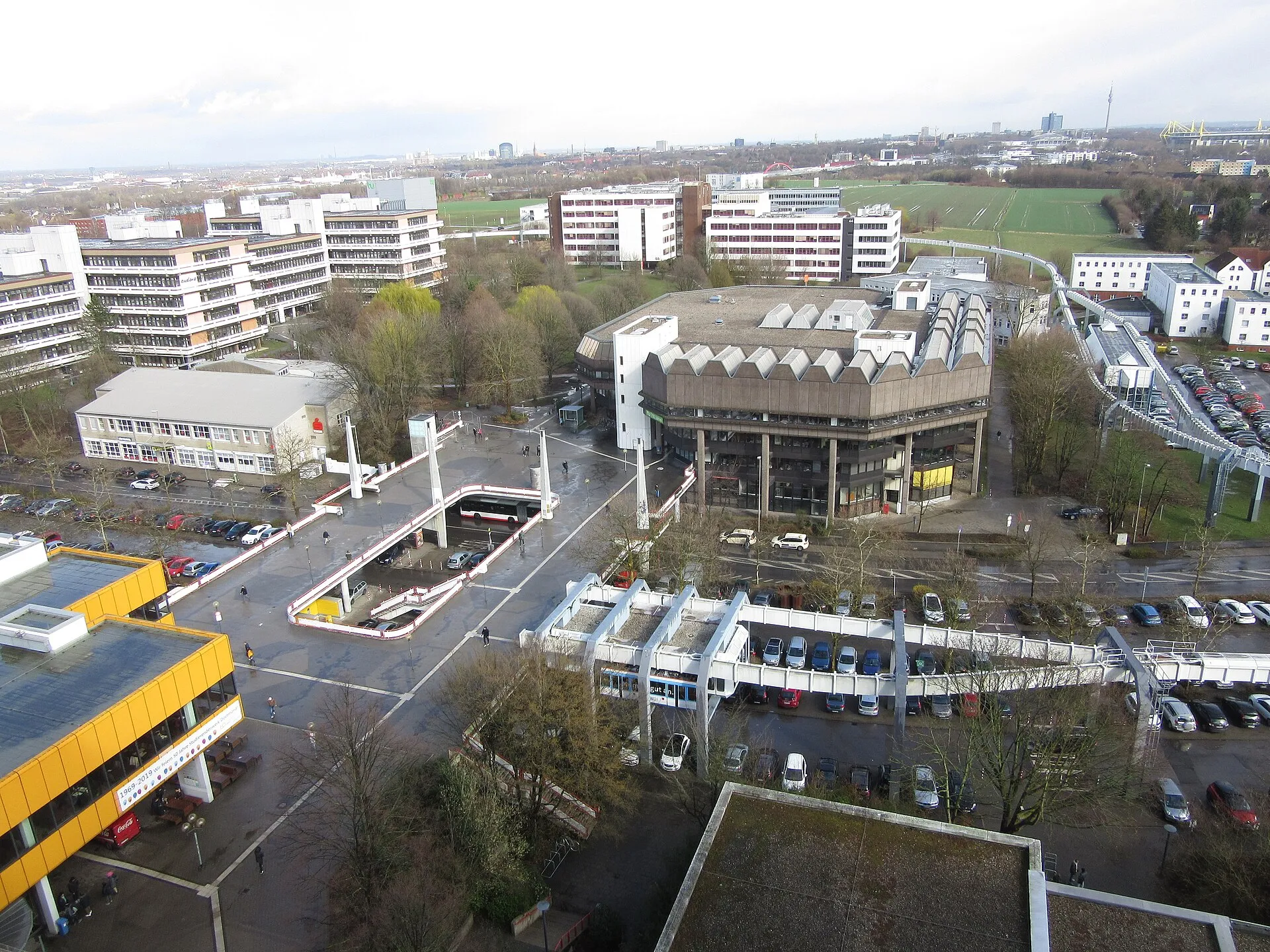 TU Dortmund Campus Nord from the Mathetower: the library, the H-Bahn track curving through, Dortmund and the BVB stadium on the horizon